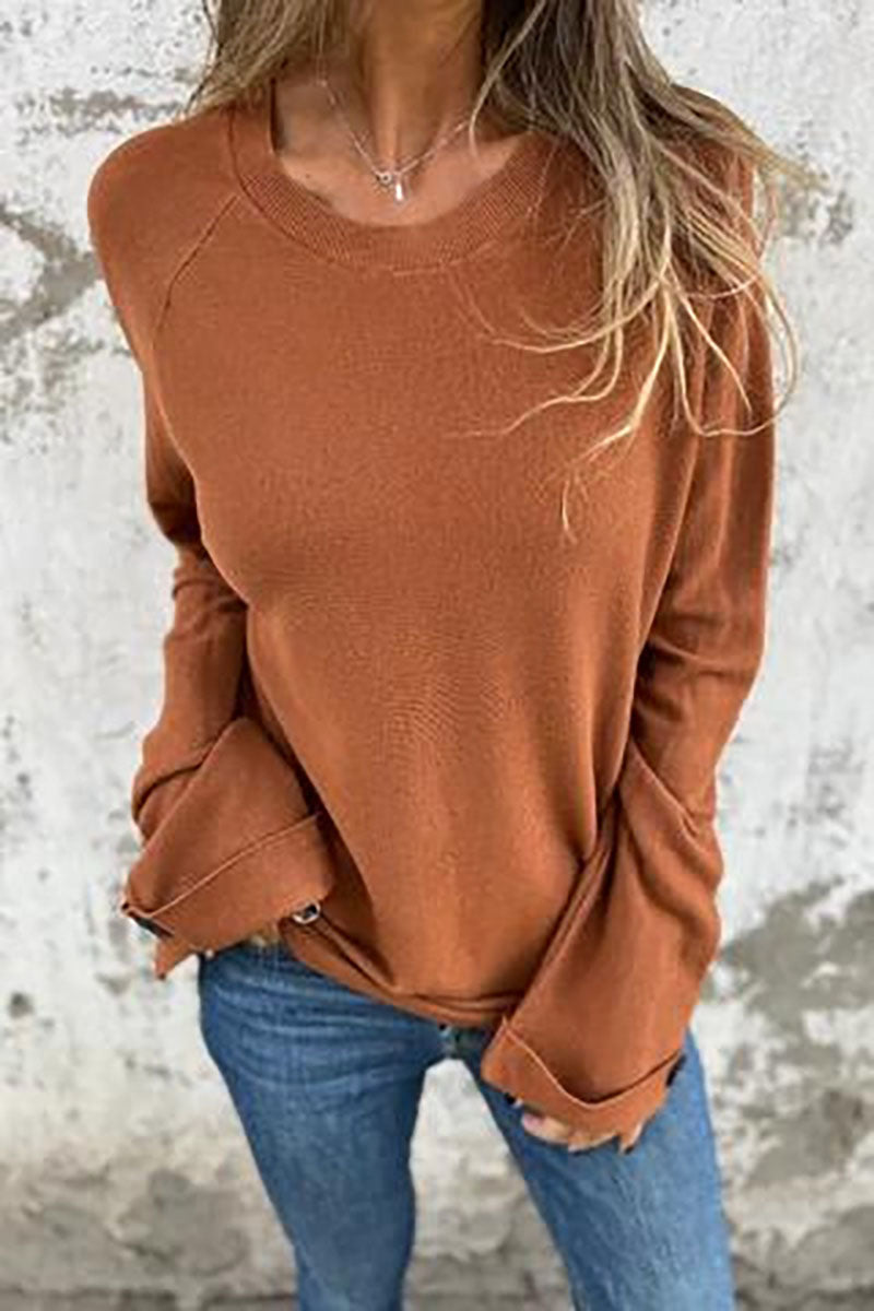 Blusa solta de cor sólida com mangas compridas e punhos abotoados