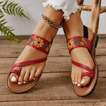 Sandales plates brodées à bride arrière