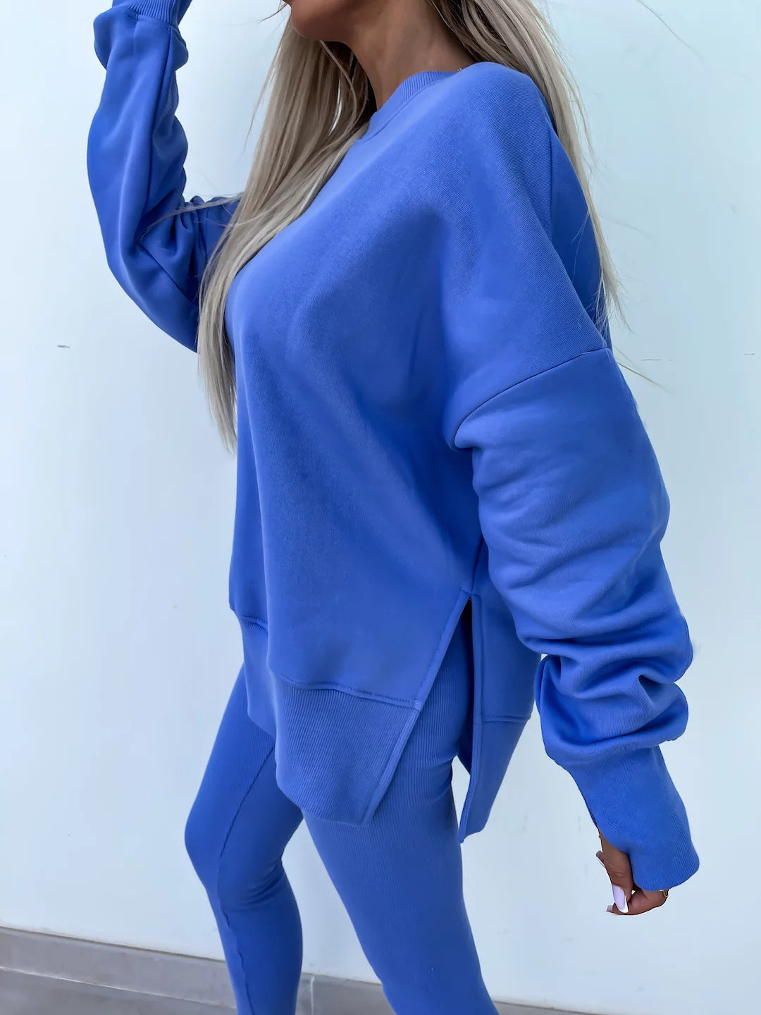 Loose long-sleeved round neck slit top and tight pants two-piece set