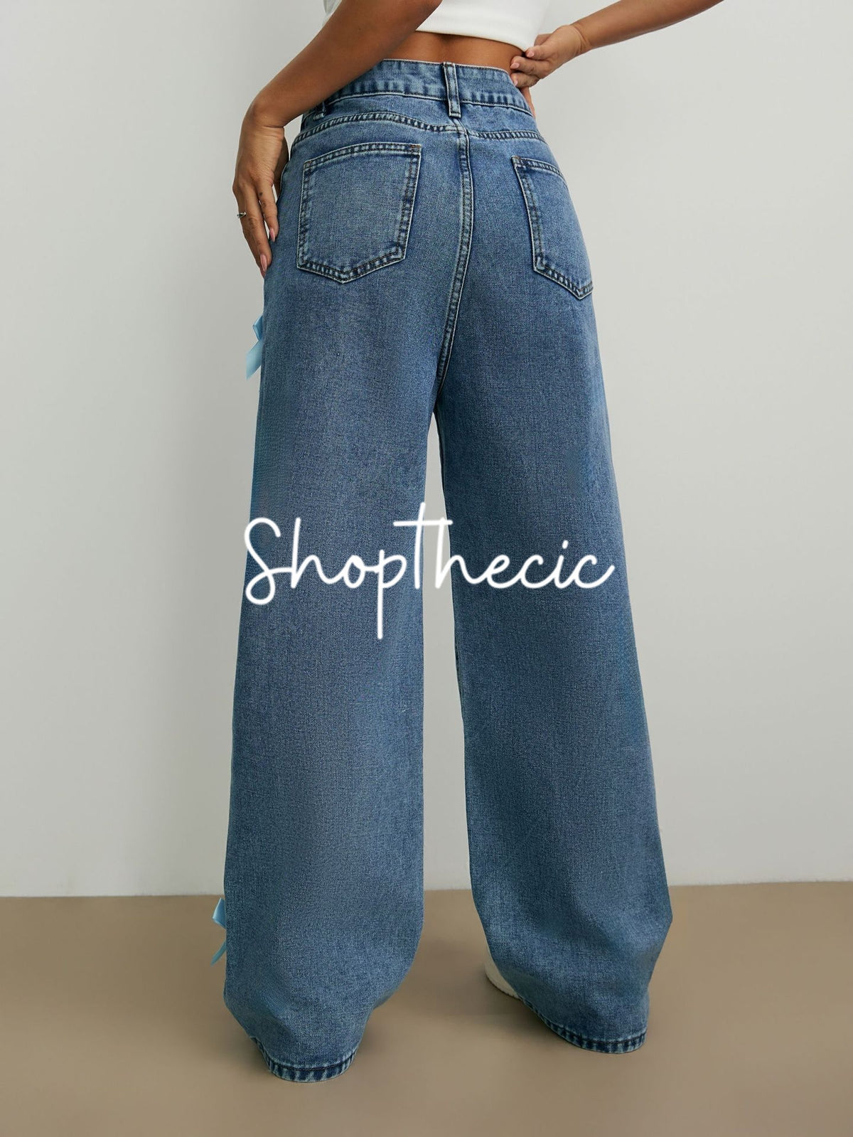 Bow-tie straight wide-leg washed jeans