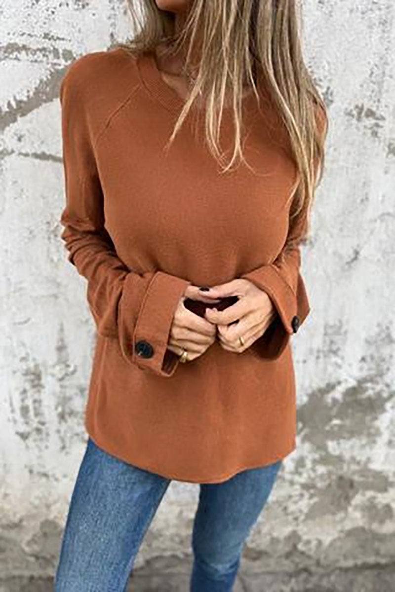 Blusa solta de cor sólida com mangas compridas e punhos abotoados