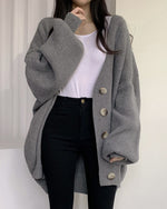 Cardigan tricoté à manches lanternes amples à simple boutonnage et col en V