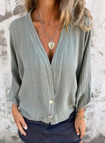 Low-cut V-neck button-down cotton and linen shirt