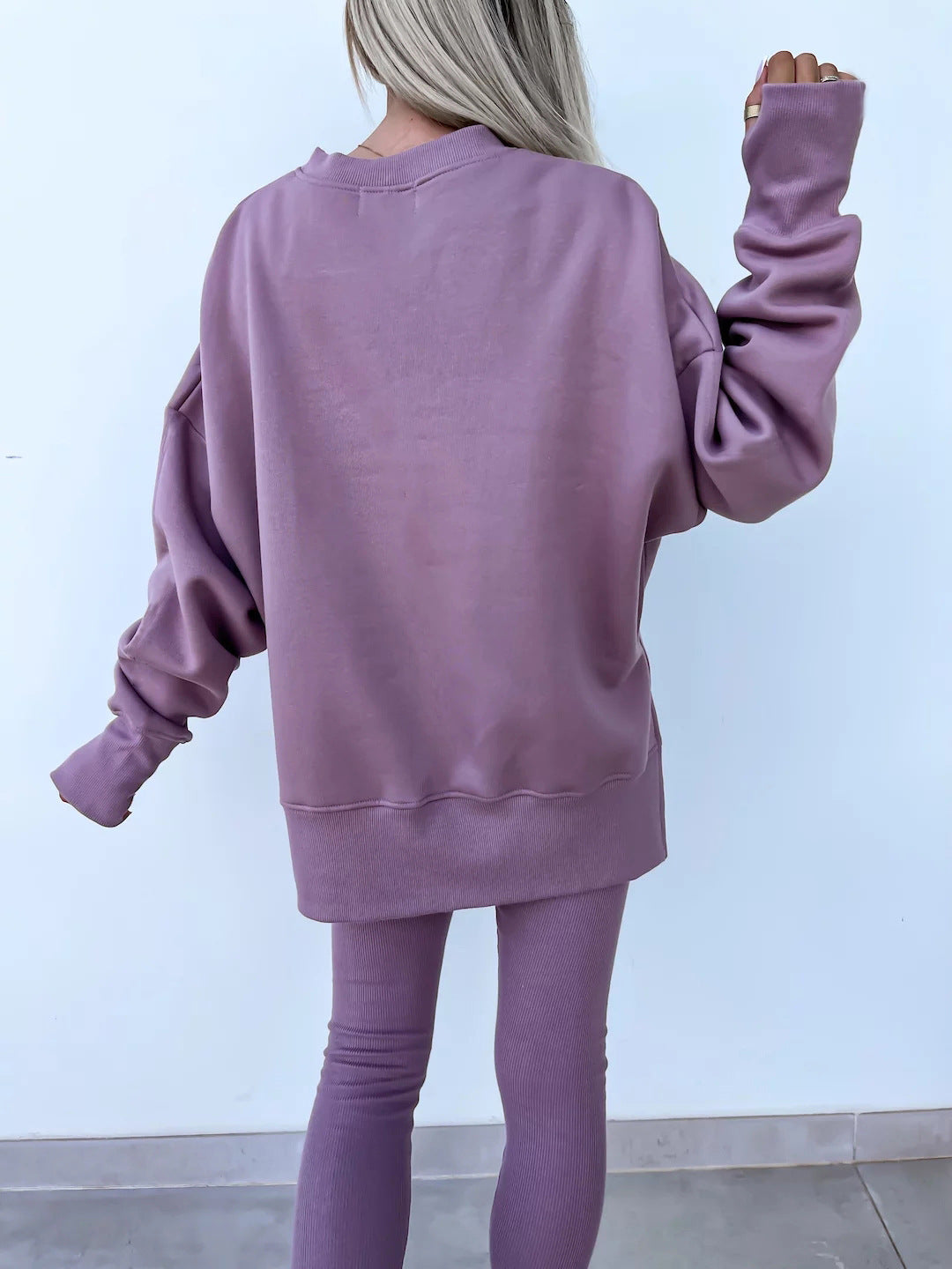 Loose long-sleeved round neck slit top and tight pants two-piece set