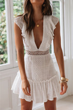 Rückenfreies, besticktes Spitzenkleid mit tiefem V-Ausschnitt