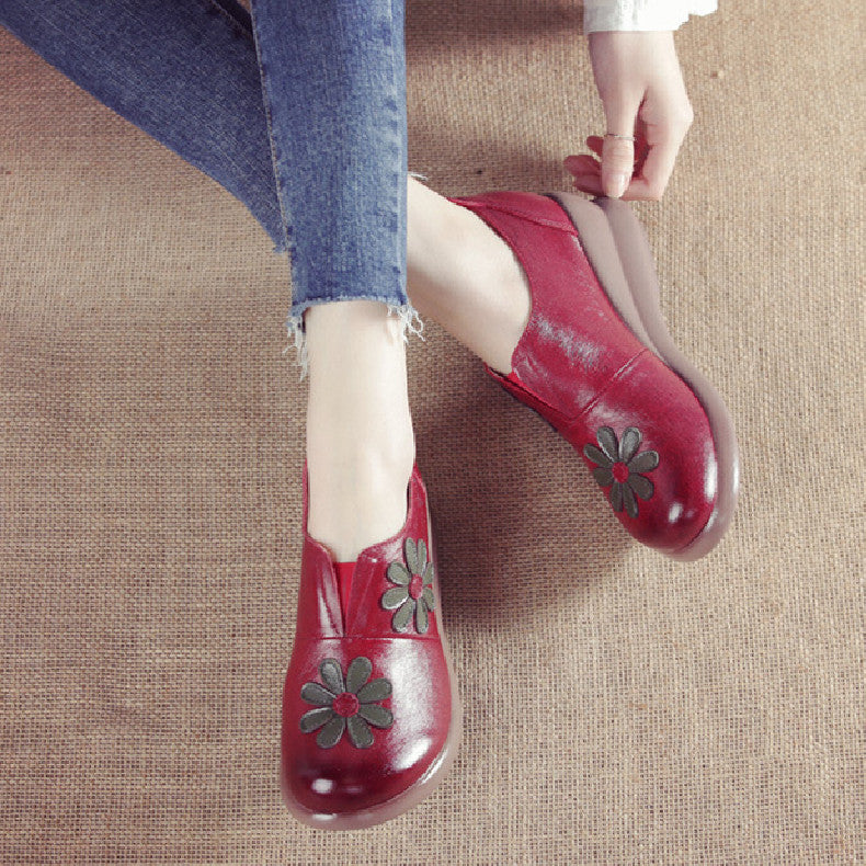 Mocassins compensés en cuir brodés de fleurs