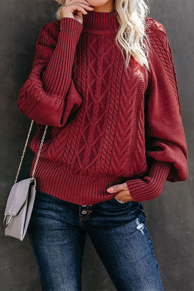 Pull en tricot torsadé à col mi-haut