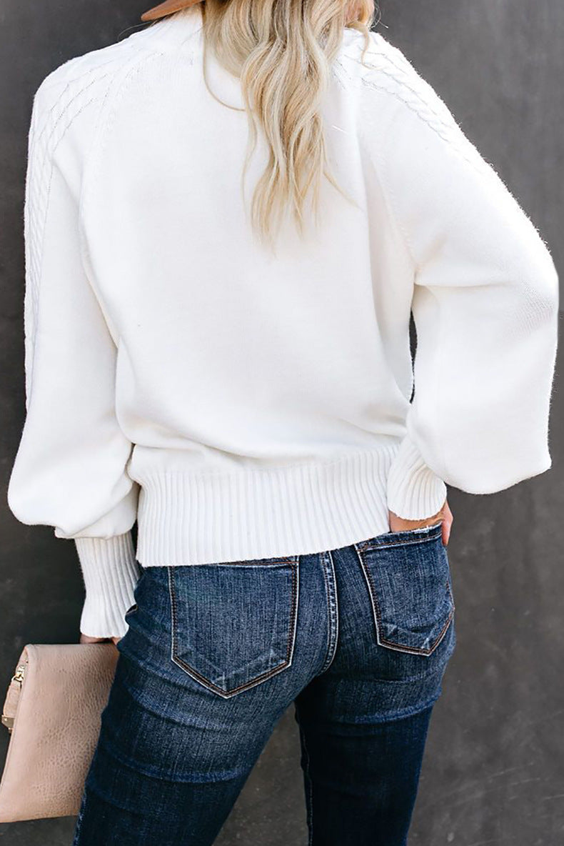Pull en tricot torsadé à col mi-haut