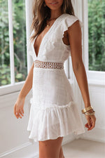 Rückenfreies, besticktes Spitzenkleid mit tiefem V-Ausschnitt