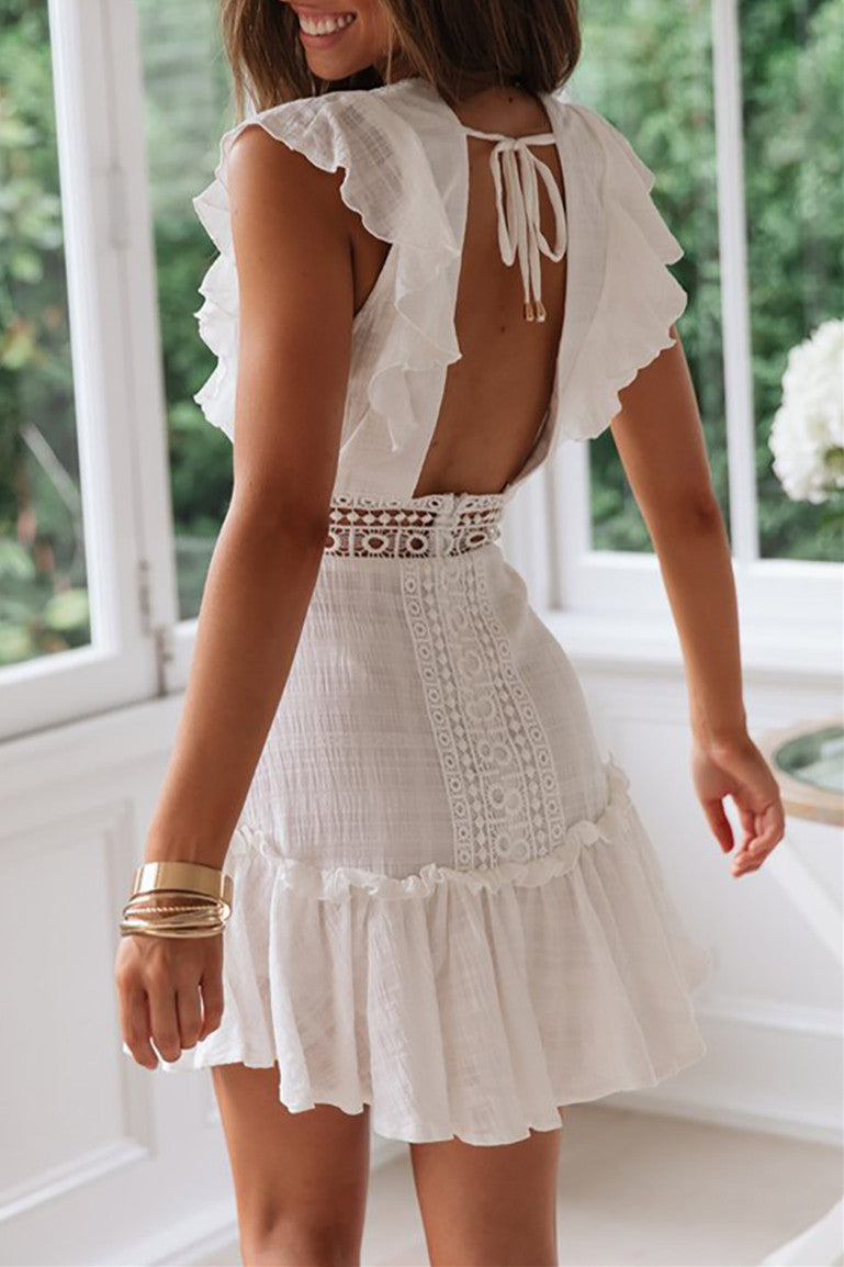 Robe en dentelle brodée dos nu en V profond