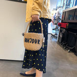 Sac seau rond en paille tissée en rotin