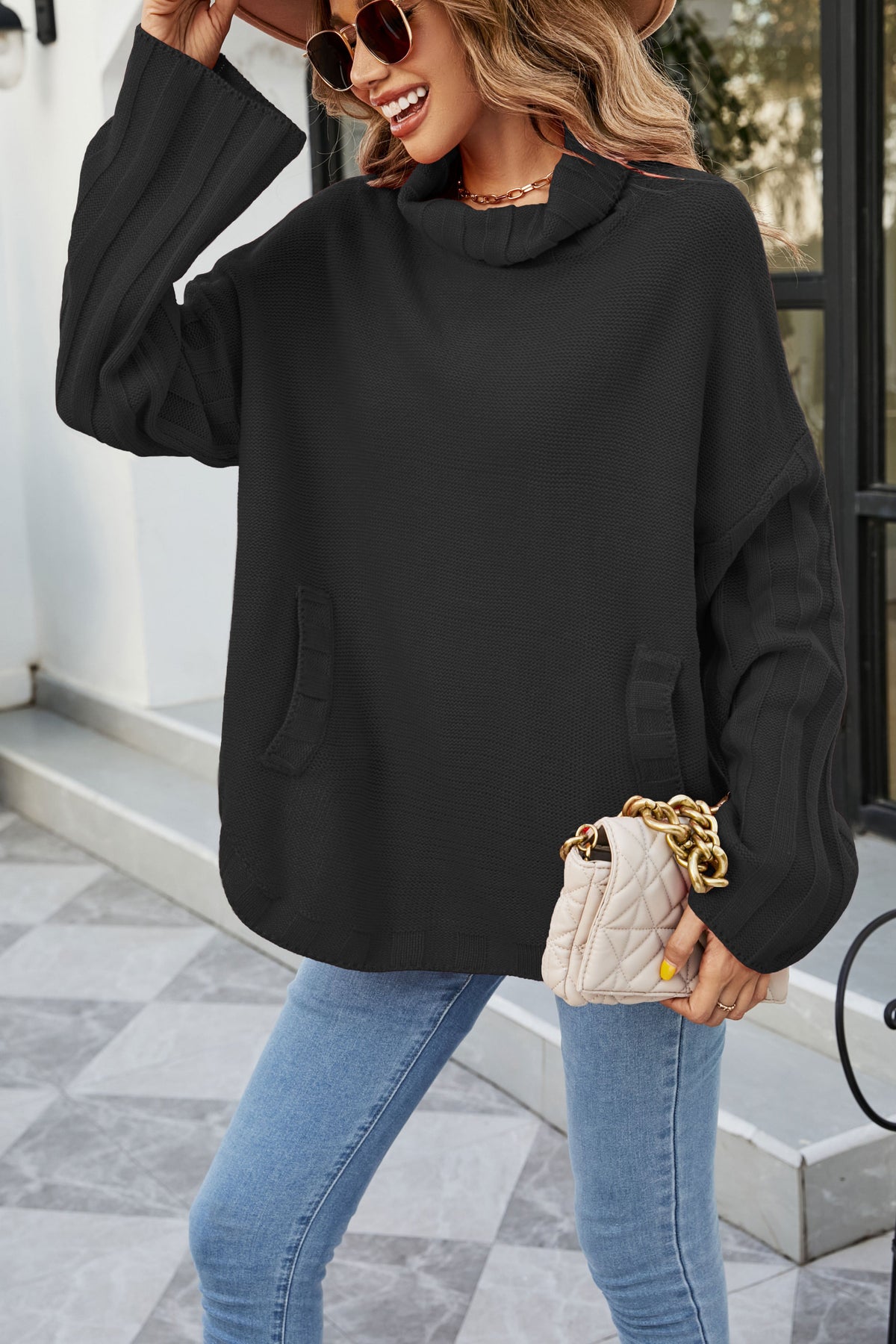 Pull surdimensionné en tricot à col roulé et poche kangourou